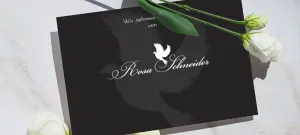 Stilvolle Trauerkarte in schwarz mit eleganter weißer Schrift, Taube