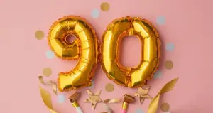 Goldene 90 als Luftballon mit bunten Konfetti das aus Geschenk platzt, Vorlage für Geburtstagseinladung