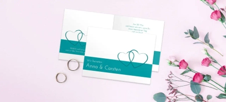 Einladung von Anna und Carsten  – klassisch elegant mit Herzen, Ringen in Türkis